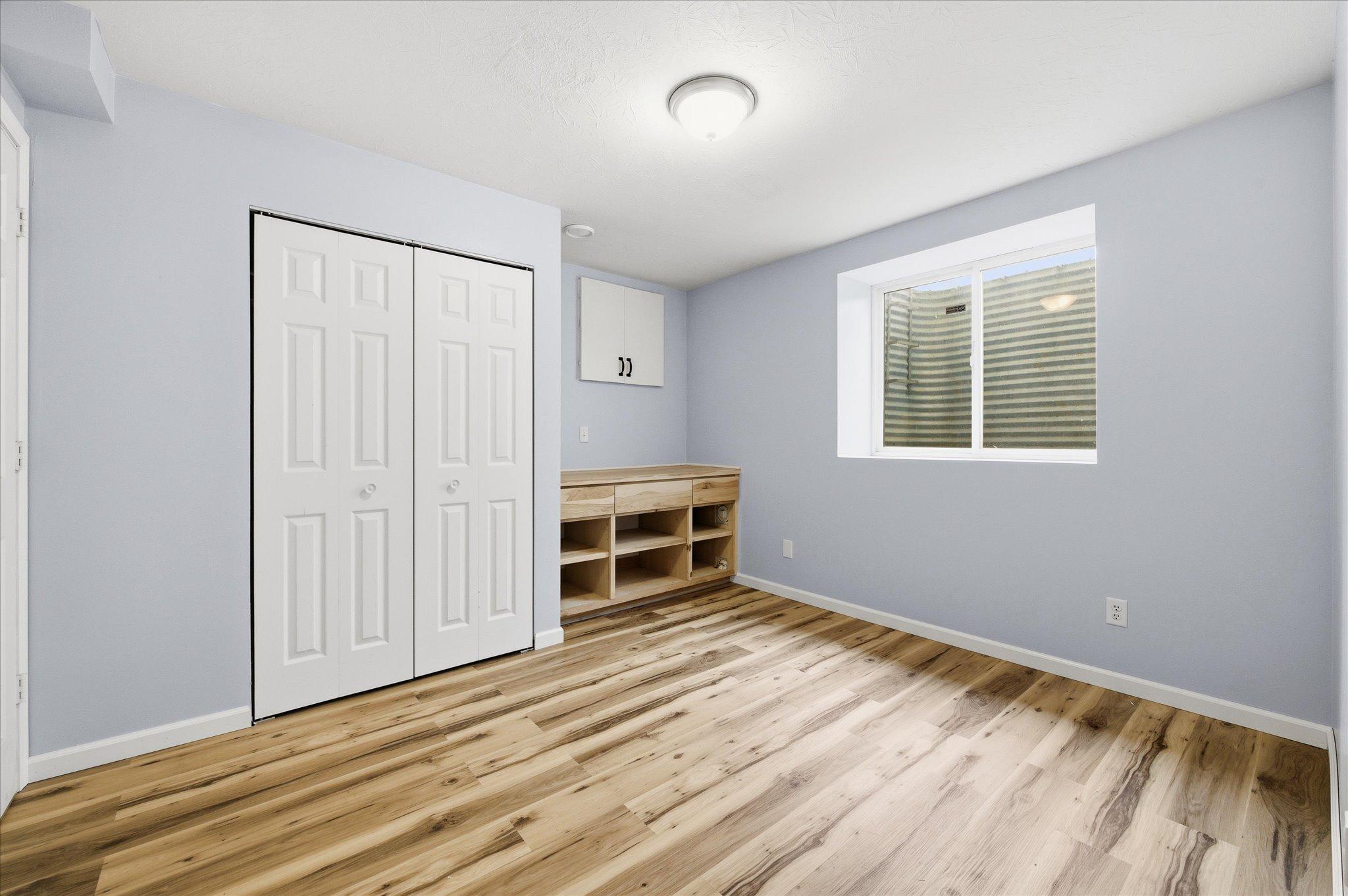 Lower level bedroom. Additional laundry closet outside the lower level bedroom