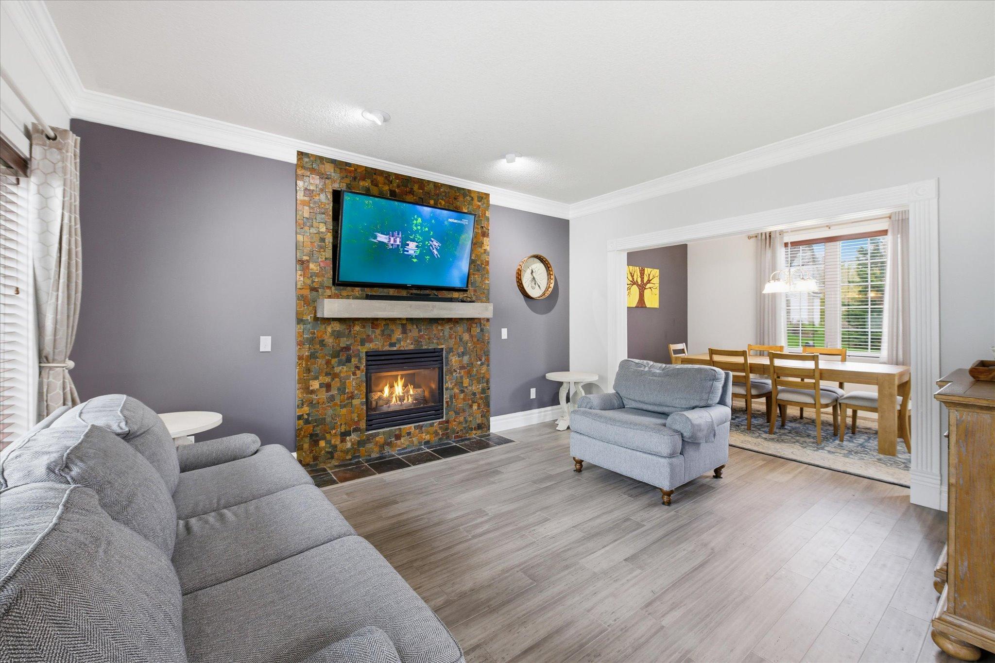 Gas fireplace with stone surround in the living room