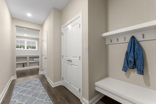 Off of the garage entry is a half-bath, large coat closet and bench, easy access for your everyday things!