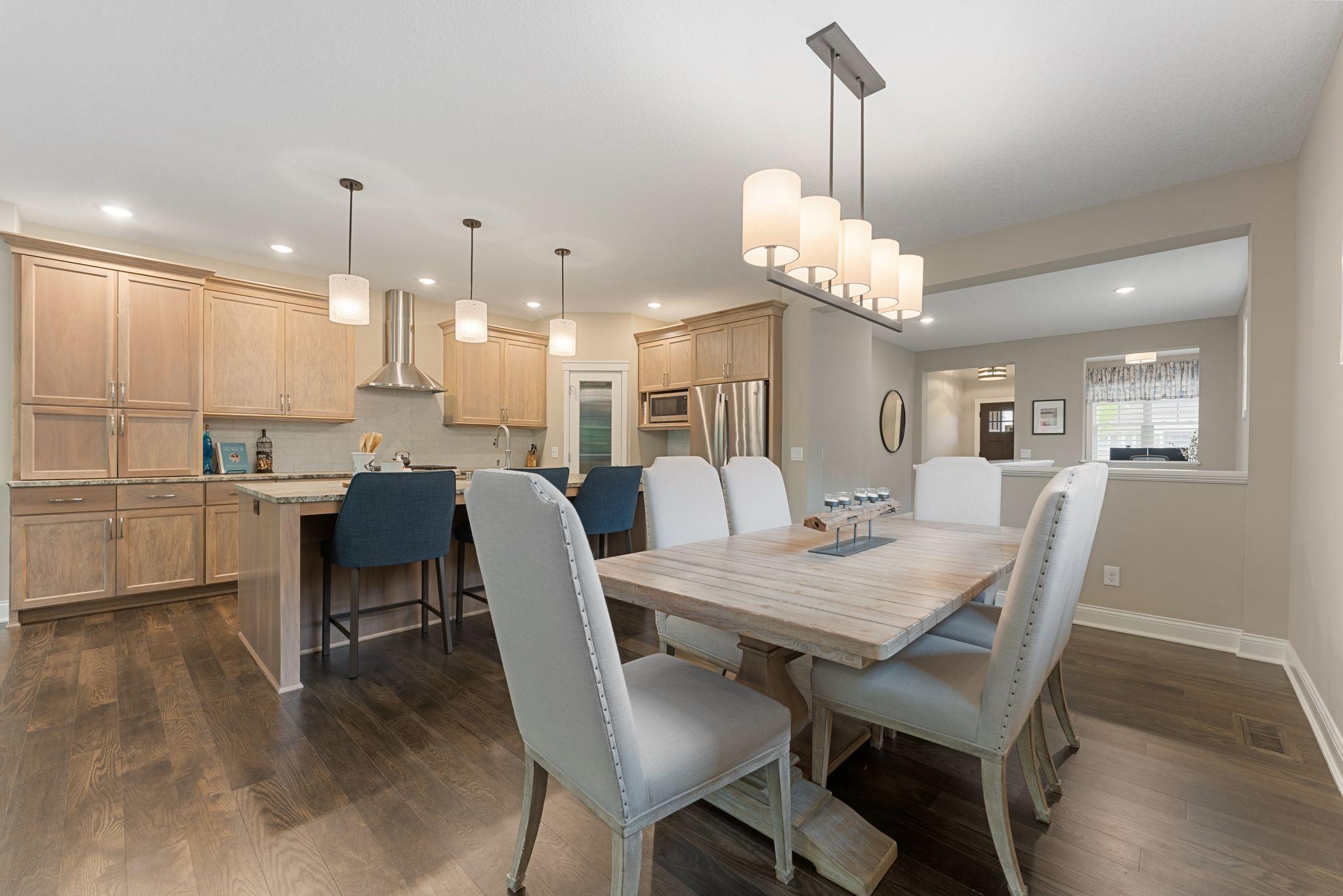 The open floorplan is seamless -- this dining room has space for your larger table and can extend, if need be.