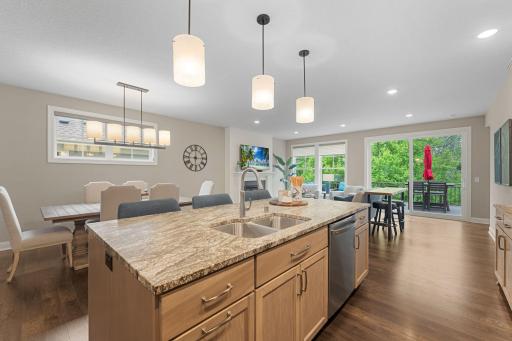 The extended/upgraded island has a GORGEOUS custom granite that ties beautifully with the cabinetry and design! All of the details that are carried throughout this space are spectacular!