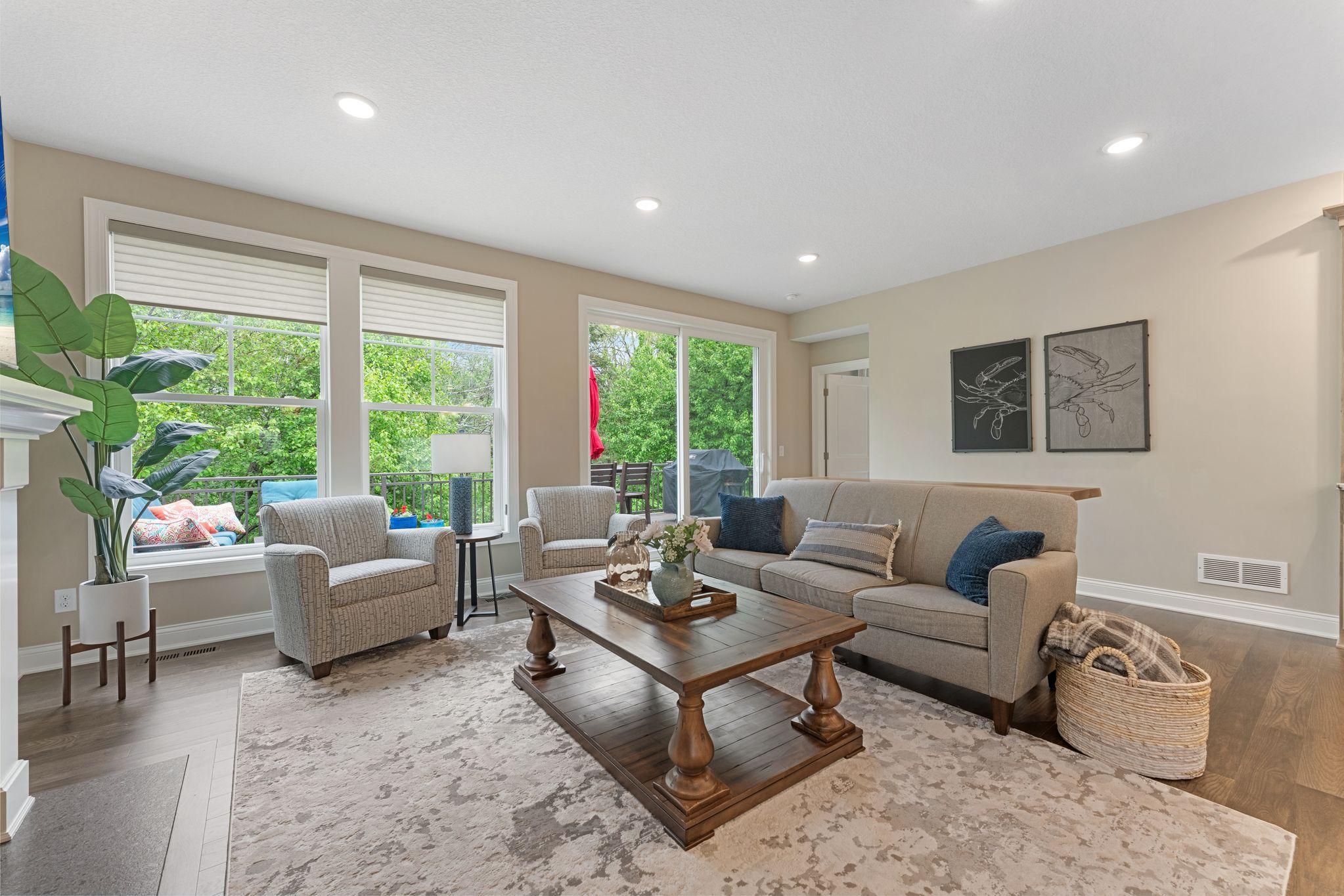 This room has such happy-vibes! You can enjoy and relax in this space all year long with peaceful views in every direction!