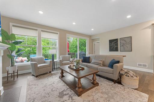 This room has such happy-vibes! You can enjoy and relax in this space all year long with peaceful views in every direction!