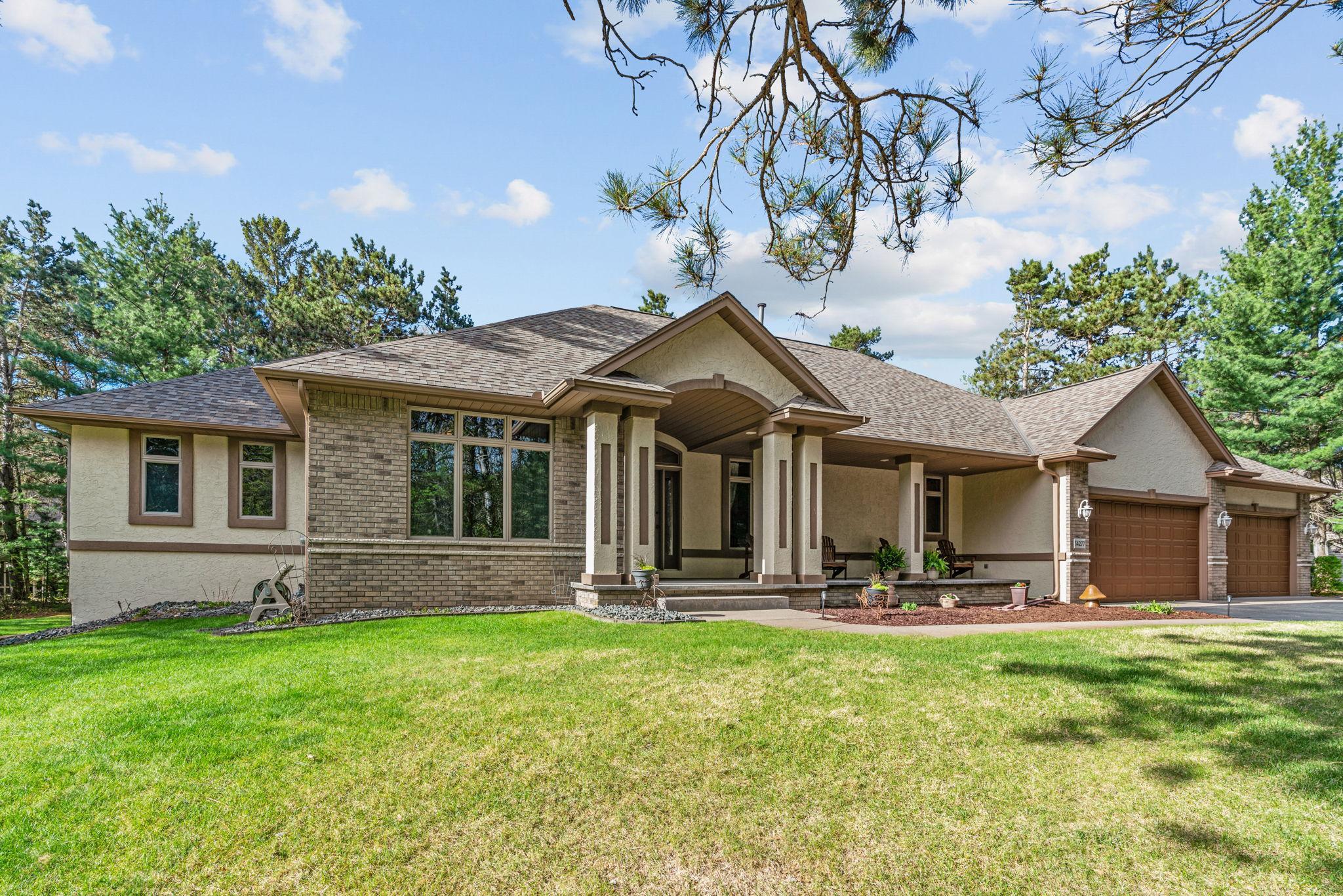 Great curb appeal with a 4-car attached garage and epoxy flooring