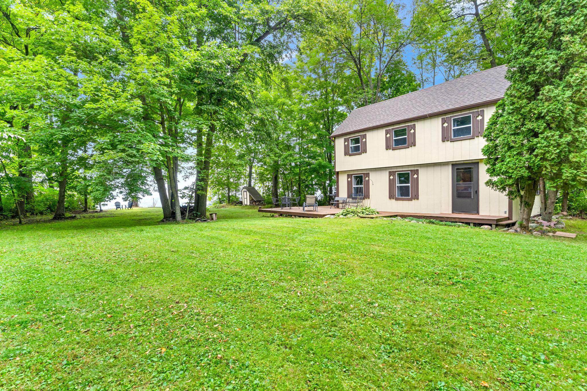 1.4 acre lot with a wonderful level yard for games or relaxing steps from the water