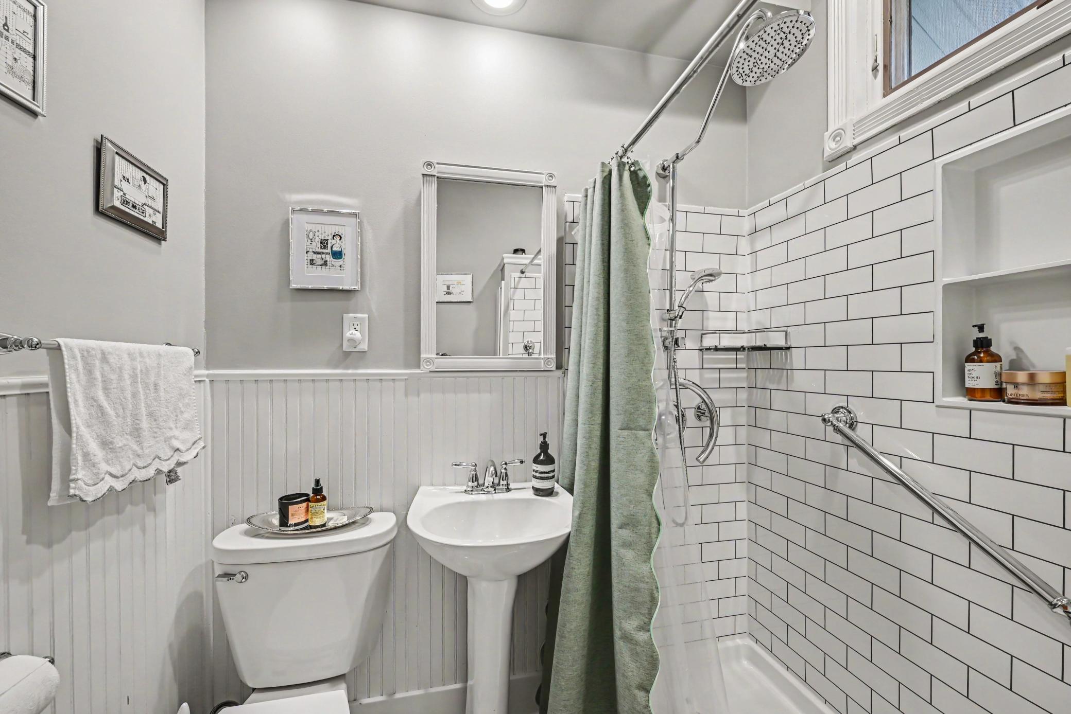 Main floor 3/4 Bath with grab bars in shower