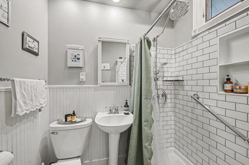 Main floor 3/4 Bath with grab bars in shower