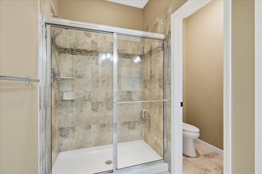 Beautiful shower with nicely done ceramic surround