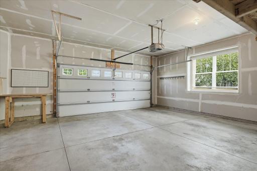 A terrific garage, especially for a townhome. Windows for natural light, plus lots of room on the side for work bench or more storage