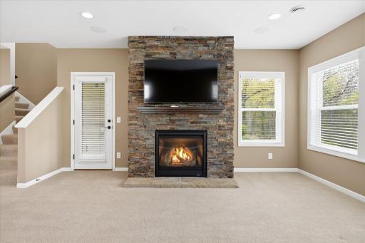 Beautiful stacked stone gas fireplace, thermostatically controlled. Lots of windows for natural light