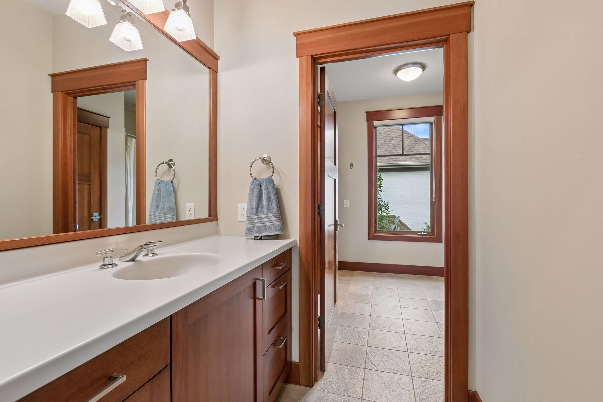 Bedroom 3 offers direct access to a Jack-and-Jill full bath with a private vanity area.