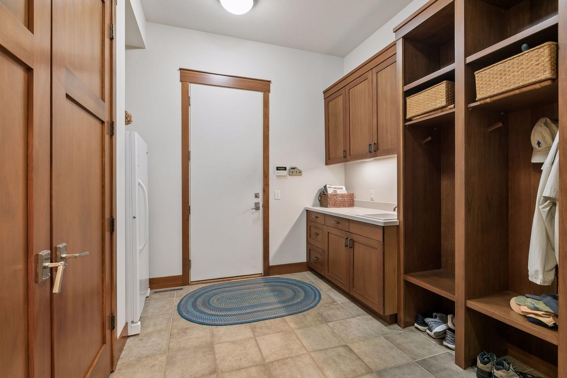 Mudroom off garage with built-in lockers.