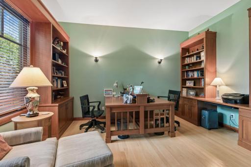 Main floor office with built-in desks and custom cabinetry.