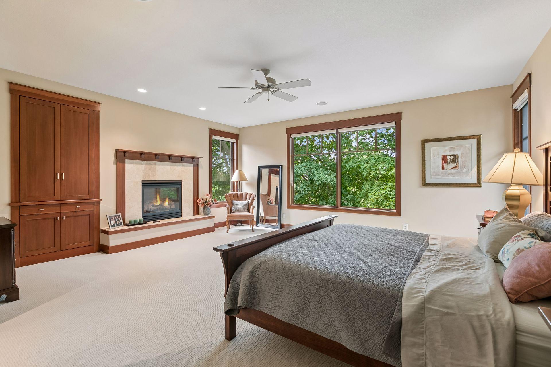 Expansive primary suite with gas fireplace.