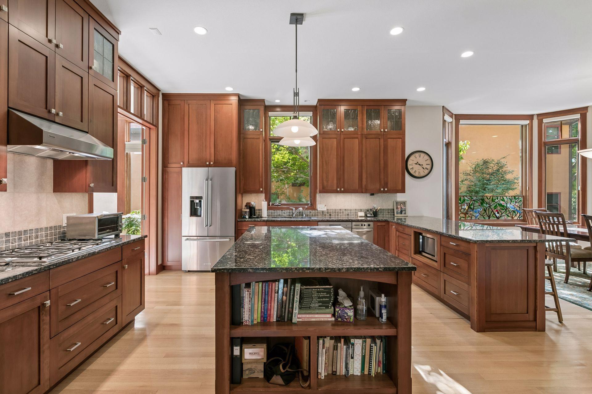 Custom cabinetry and stainless steel appliances.