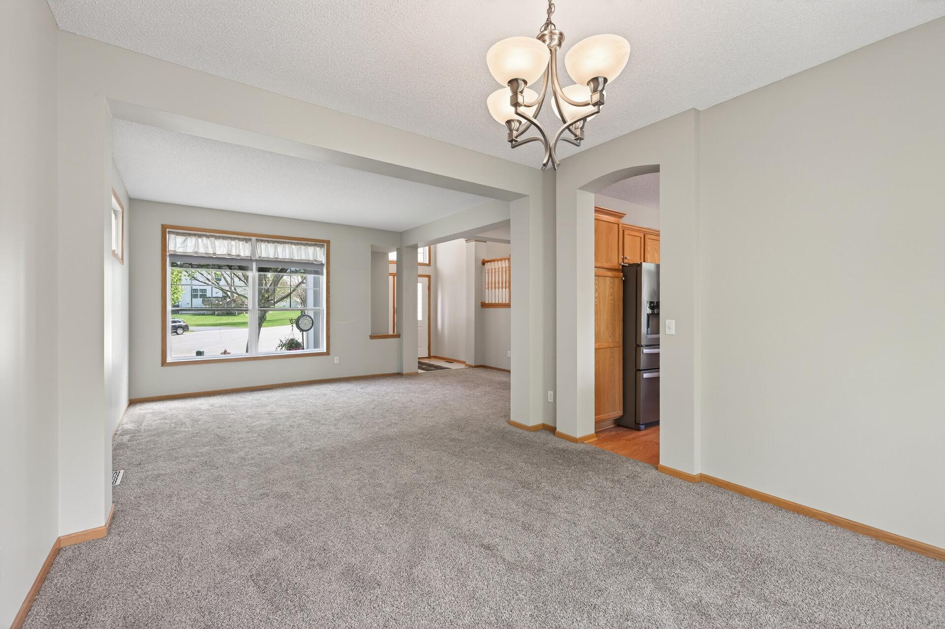 Spacious formal dining room with updated lighting and seamless flow into the main living areas.
