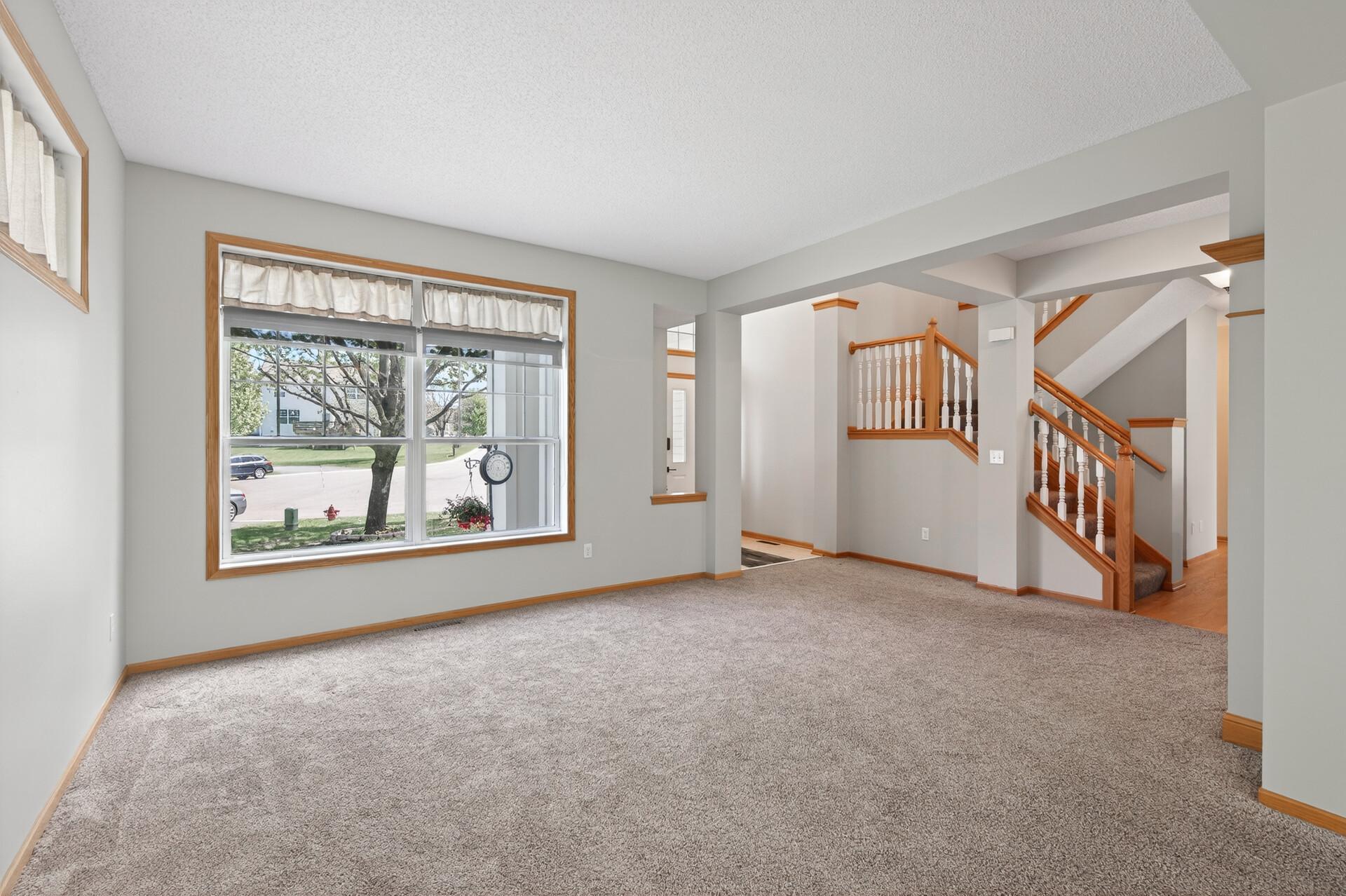 Sun-filled main level with oversized windows and elegant architectural details.