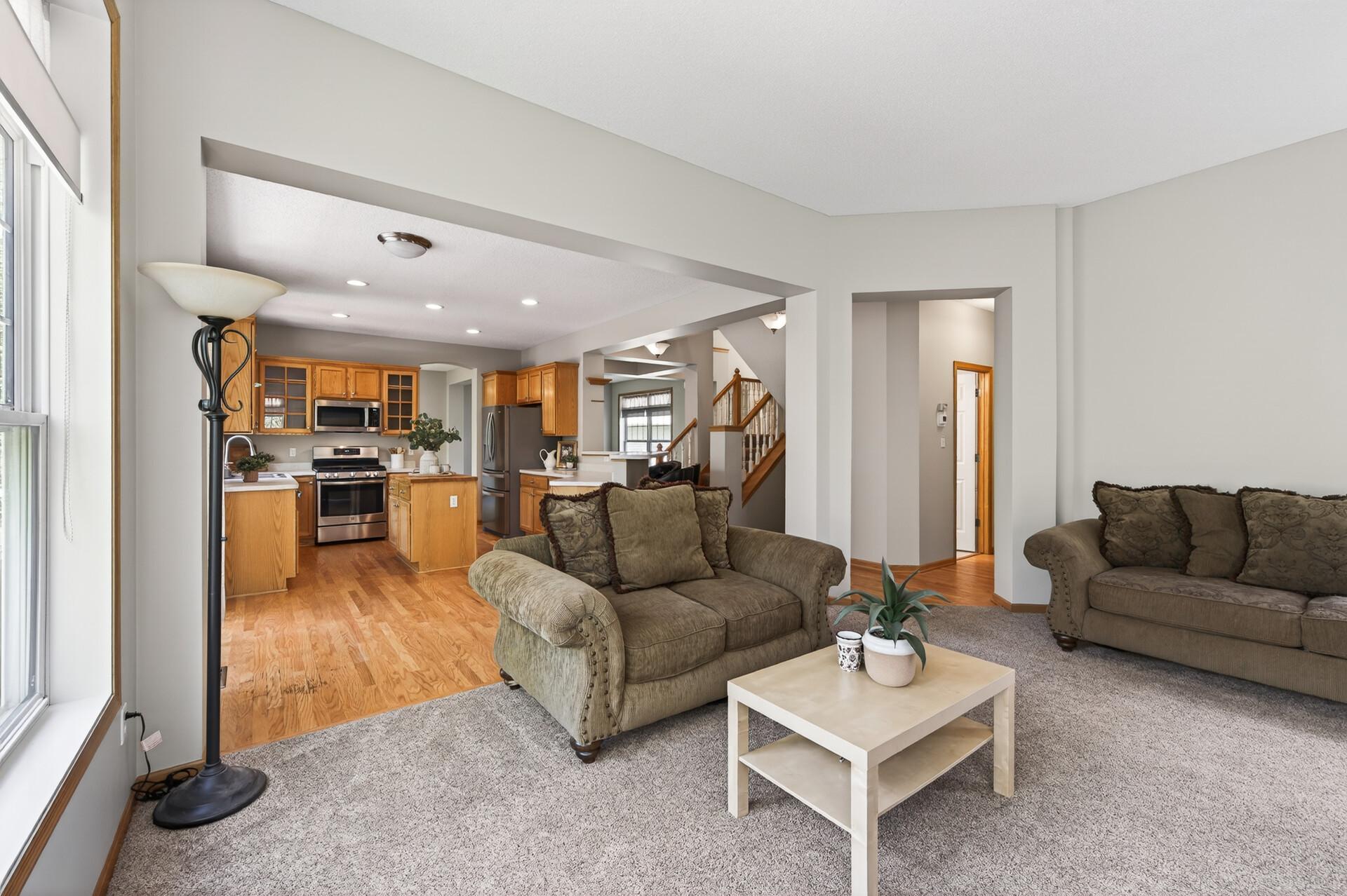 Open family room with seamless connection to the kitchen and main living spaces.