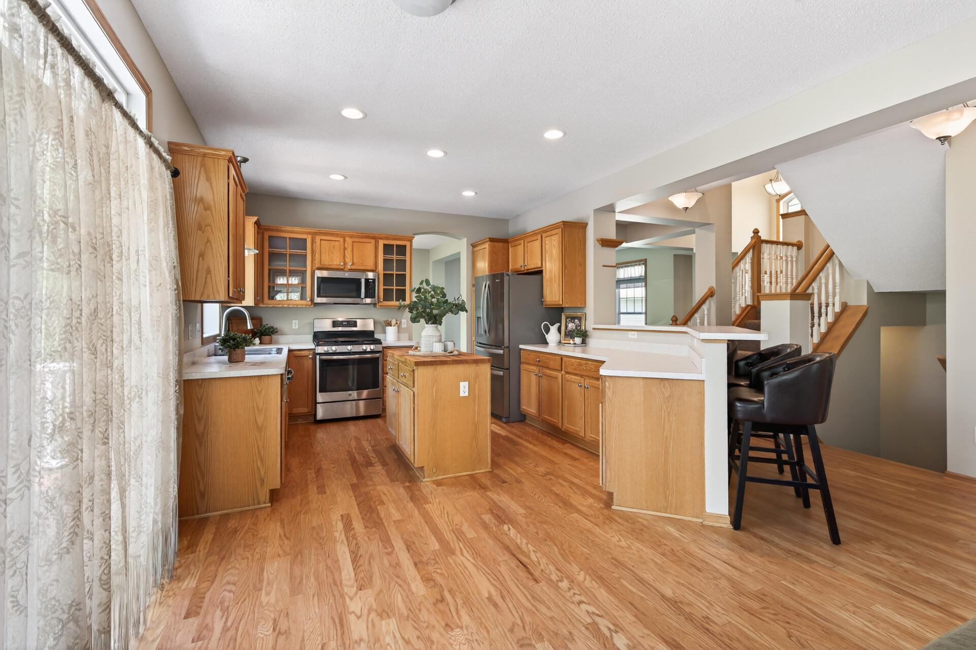 Open kitchen and informal dining area with excellent natural light and flexible gathering space.