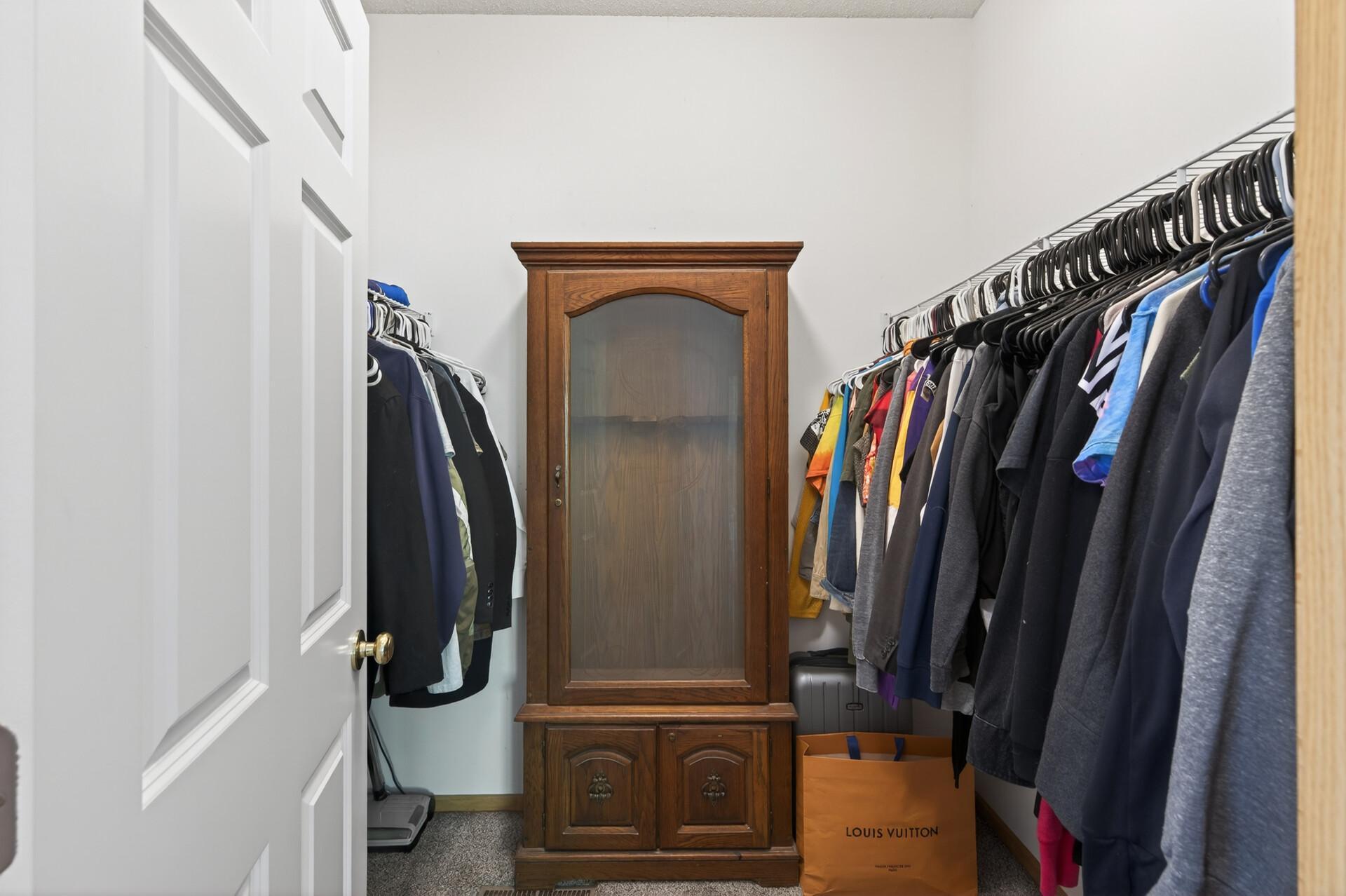Large walk-in closet offering excellent storage and organization space.