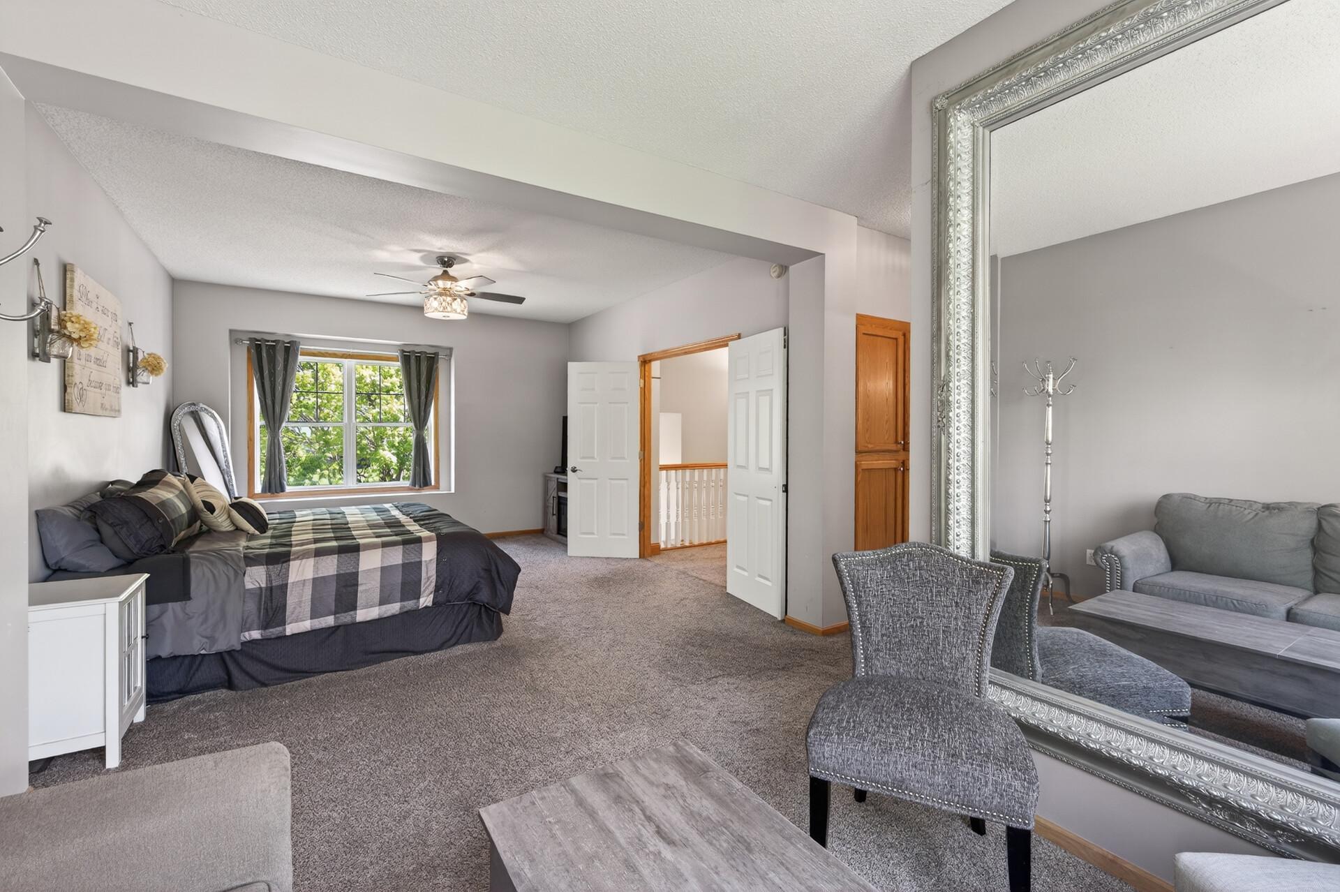 Private primary retreat featuring a versatile sitting area and abundant natural light.