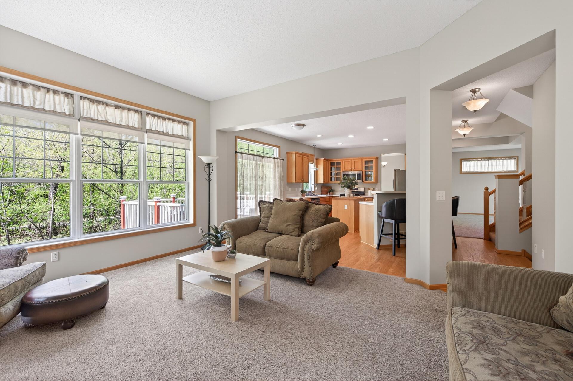 Spacious gathering area with expansive windows and an ideal layout for entertaining.