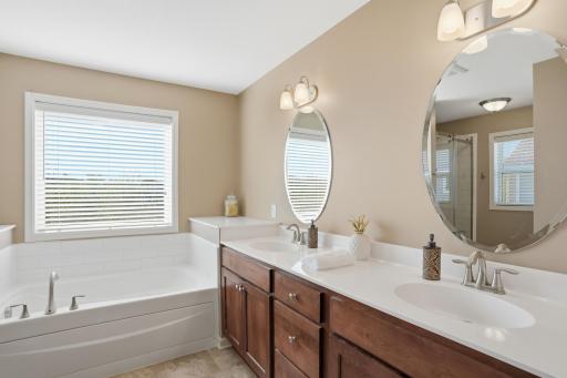Double vanities, a soaking tub, and natural light that makes mornings feel a little easier.
