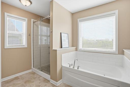 Separate tub and glass shower setup so no one has to compromise.