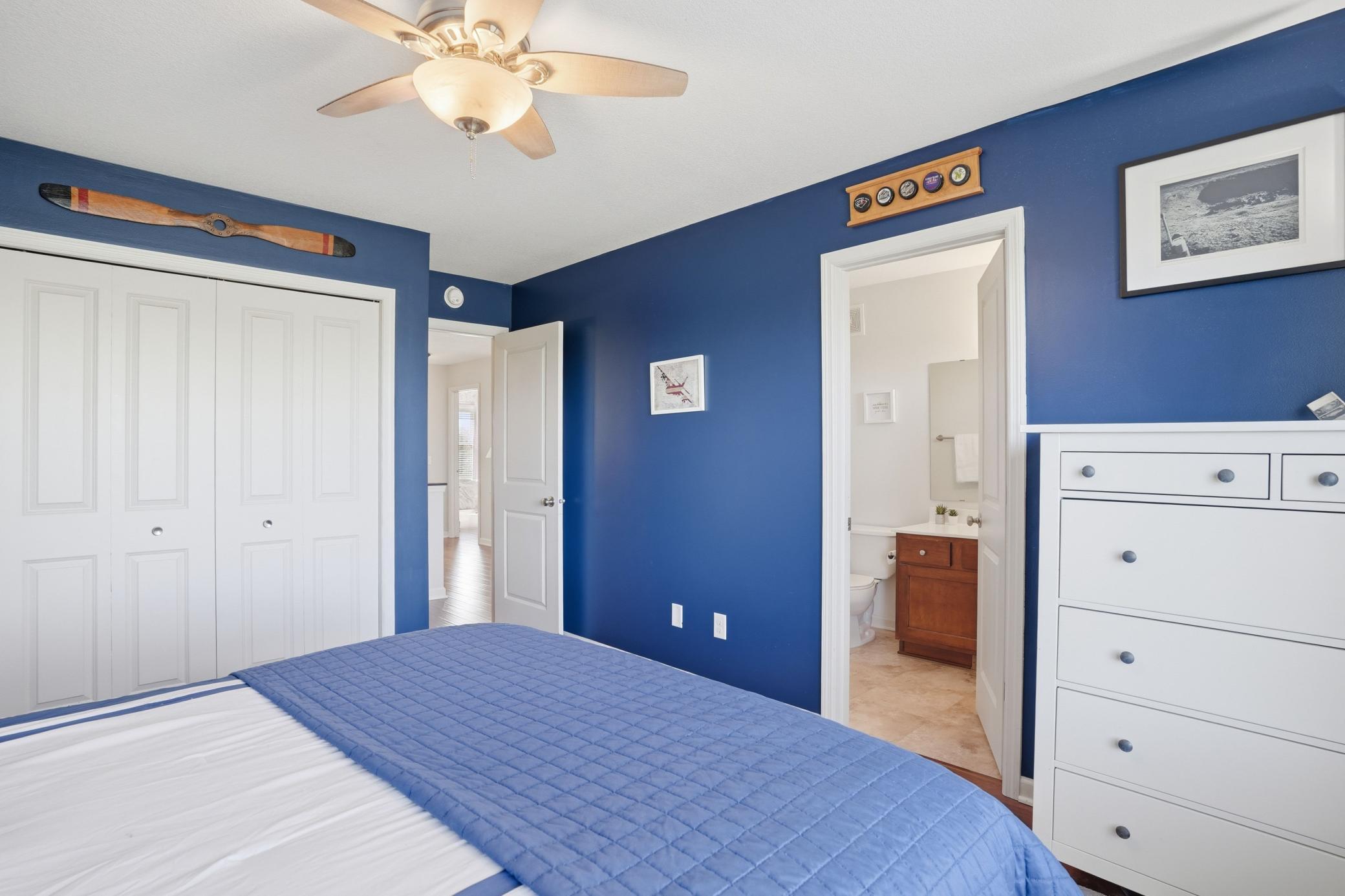 Connected ensuite bath gives this bedroom its own private setup.