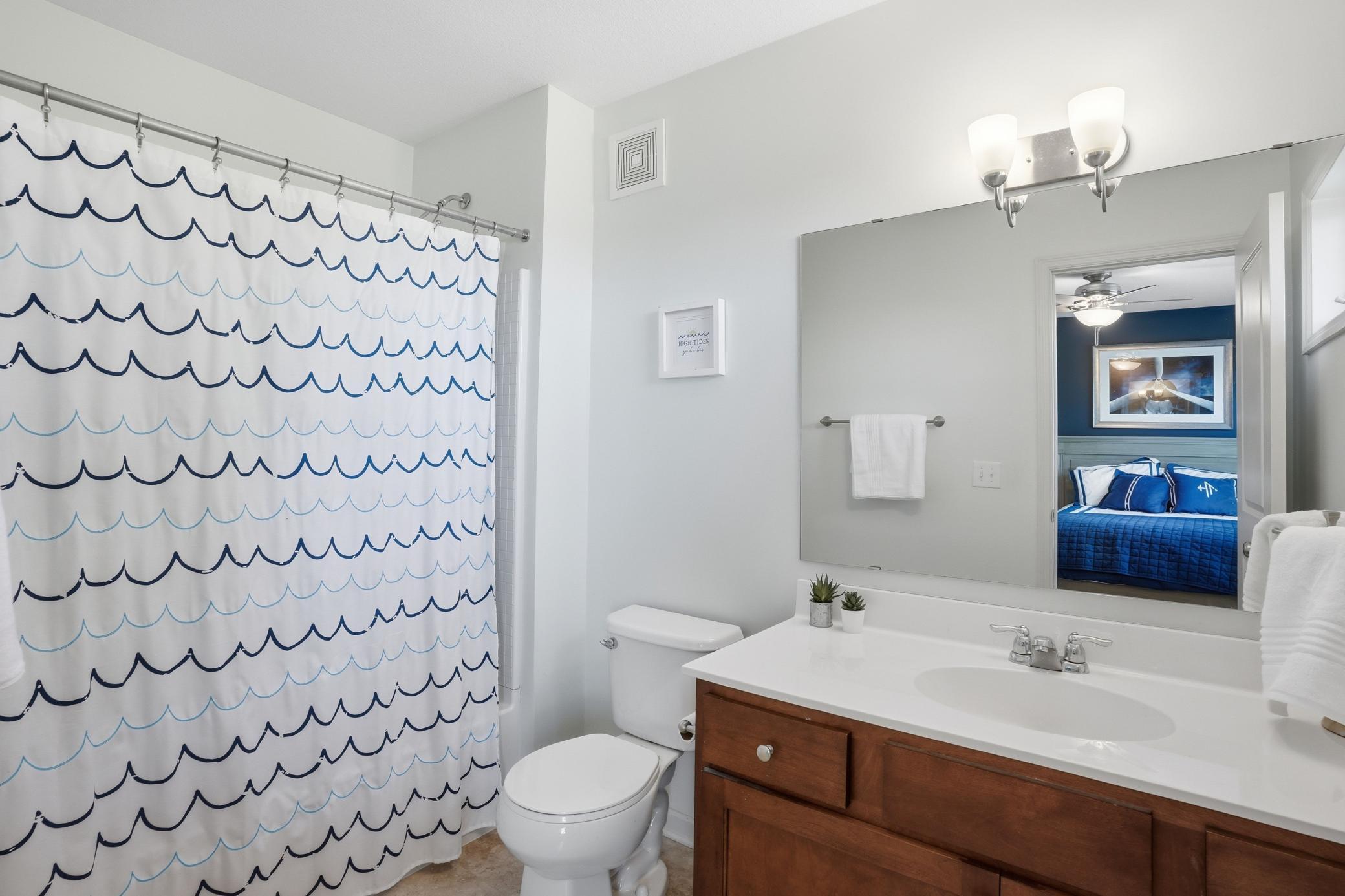Connected ensuite bath gives this bedroom its own private setup.