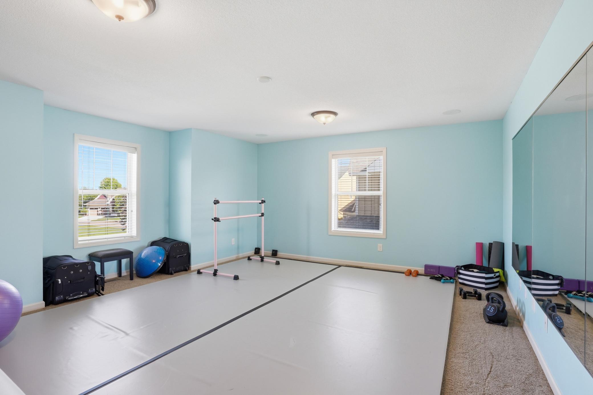 Currently set up as a dance/workout space, but easily works as a bedroom, playroom, or bonus room.