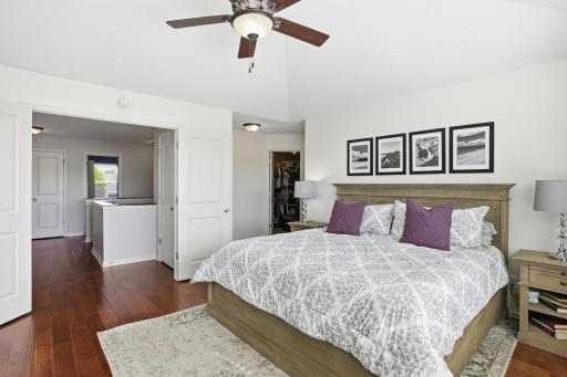 Hardwood floors, soaring ceilings, and a walk-in closet complete the primary suite.