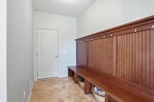 A true drop zone with built-in hooks, bench seating, and space to keep everyday clutter under control.