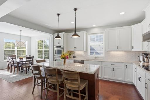 Stunning kitchen with a huge center island and tons of prep space.