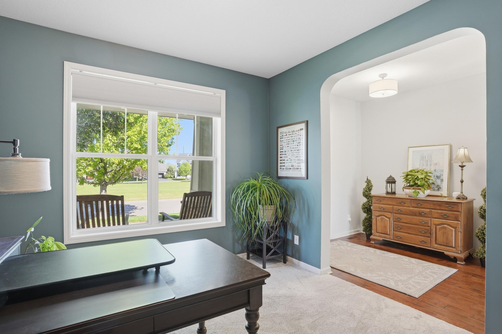 Tucked near the front of the home, this space works beautifully as an office, reading room, or second sitting area.