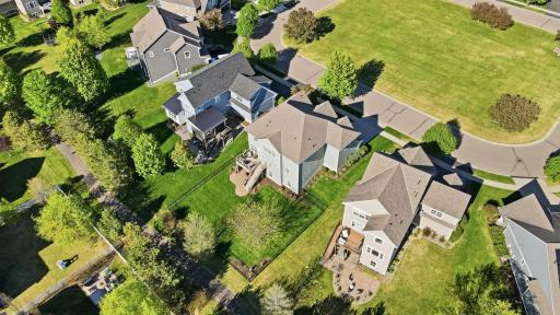 Large backyard backing to walking paths for added privacy and convenience.