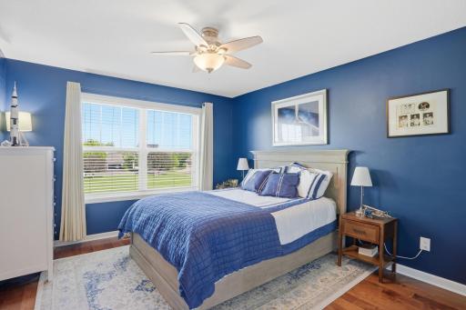 Bold blue walls and aviation details make this bedroom feel fun without sacrificing style.