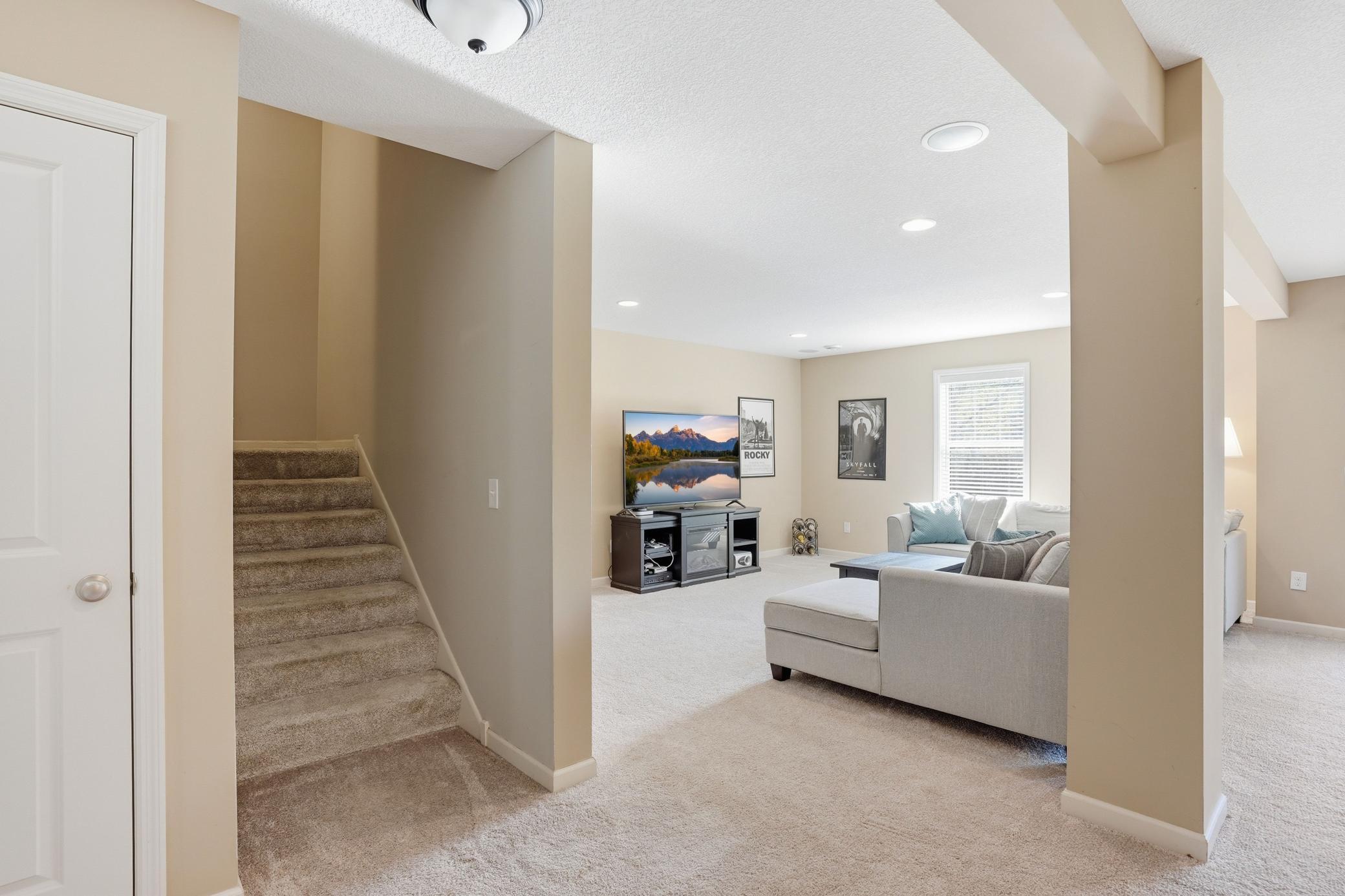 Spacious lower level with multiple areas to gather, relax, or entertain.