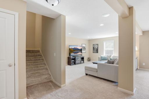 Spacious lower level with multiple areas to gather, relax, or entertain.
