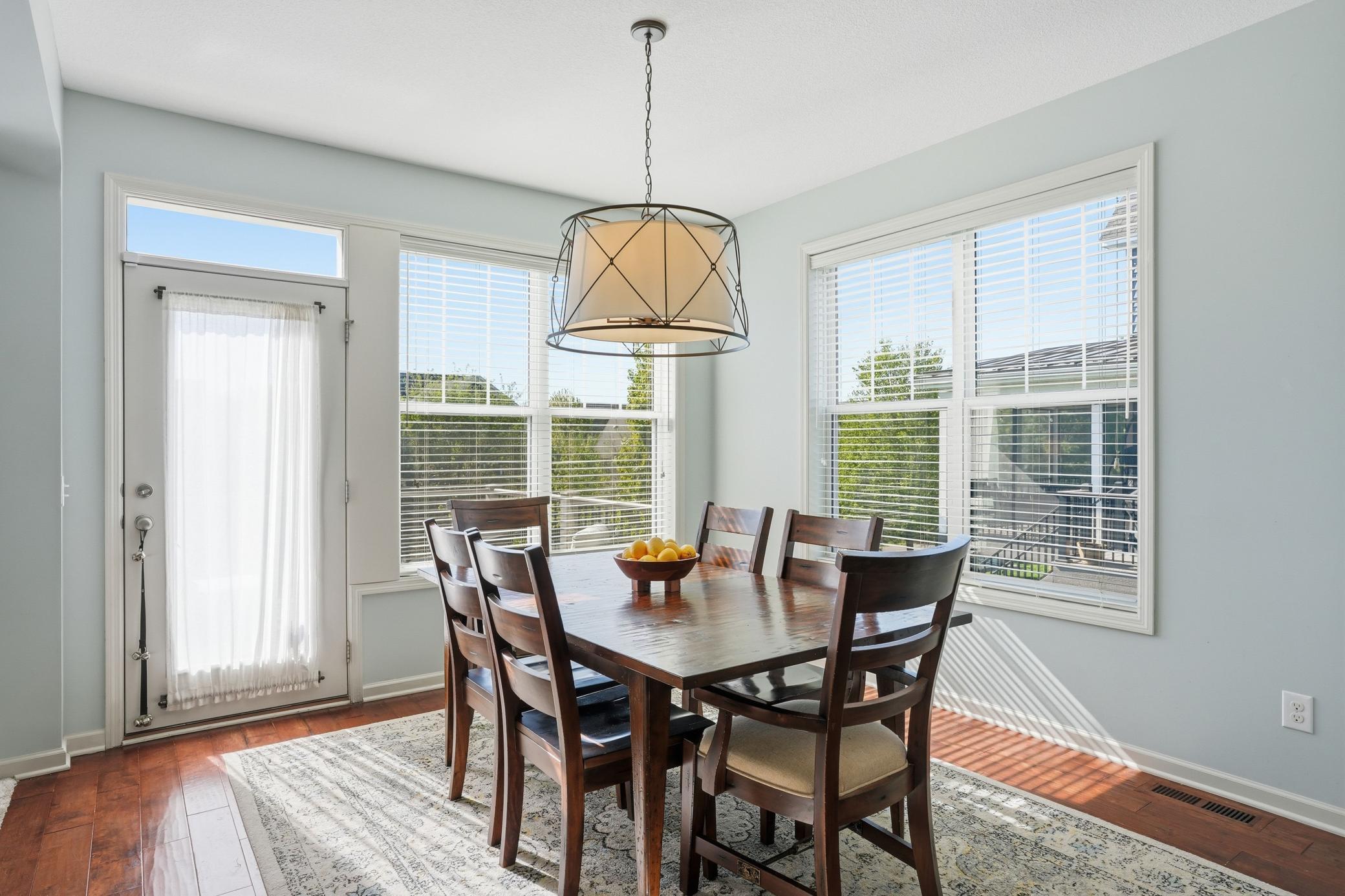 Sunny dining area with views overlooking the backyard.