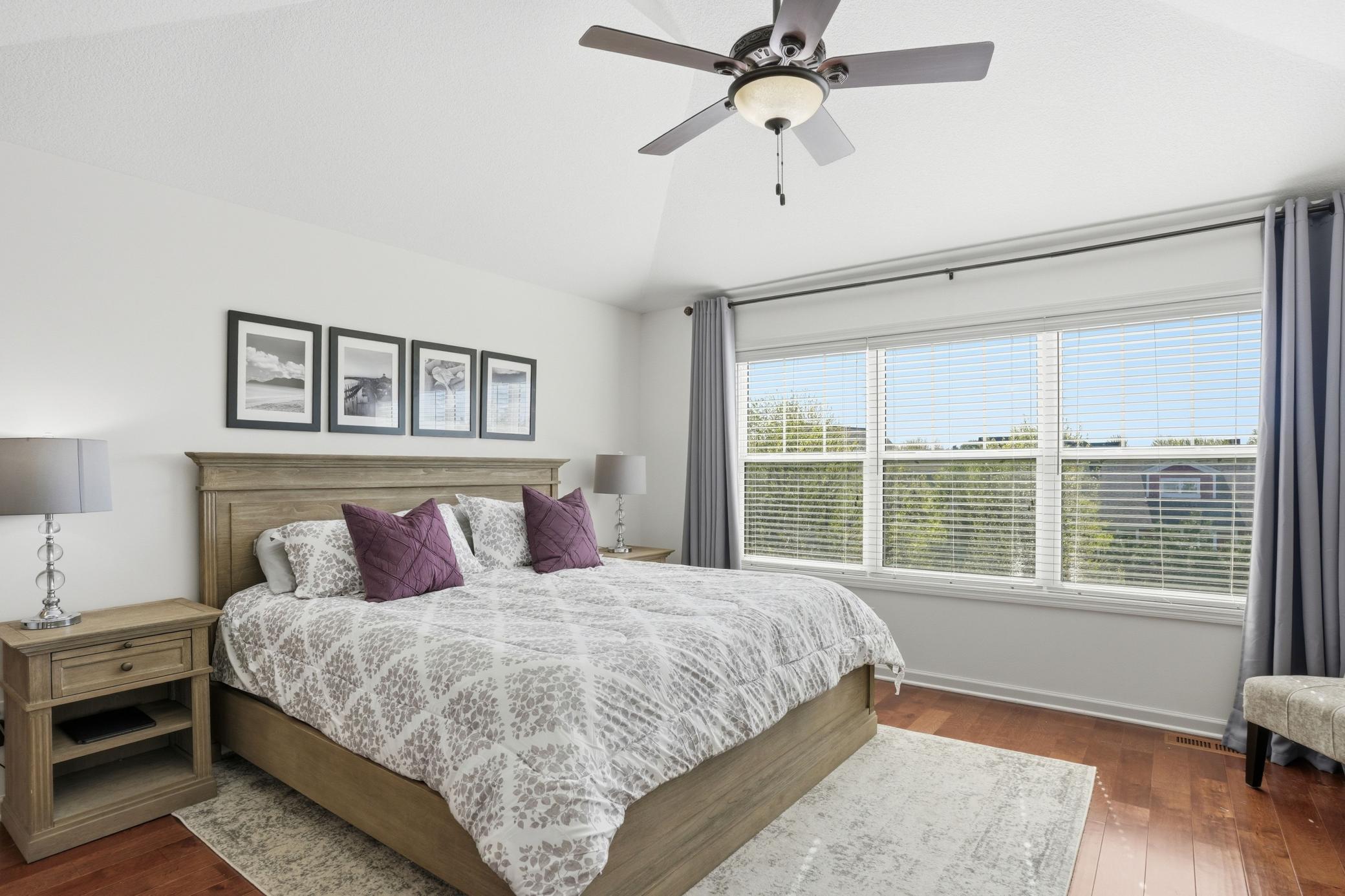 Wake up to treetop views and sunlight pouring into the spacious primary suite.