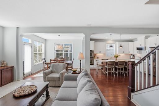 Warm hardwood floors and inviting gathering spaces throughout.
