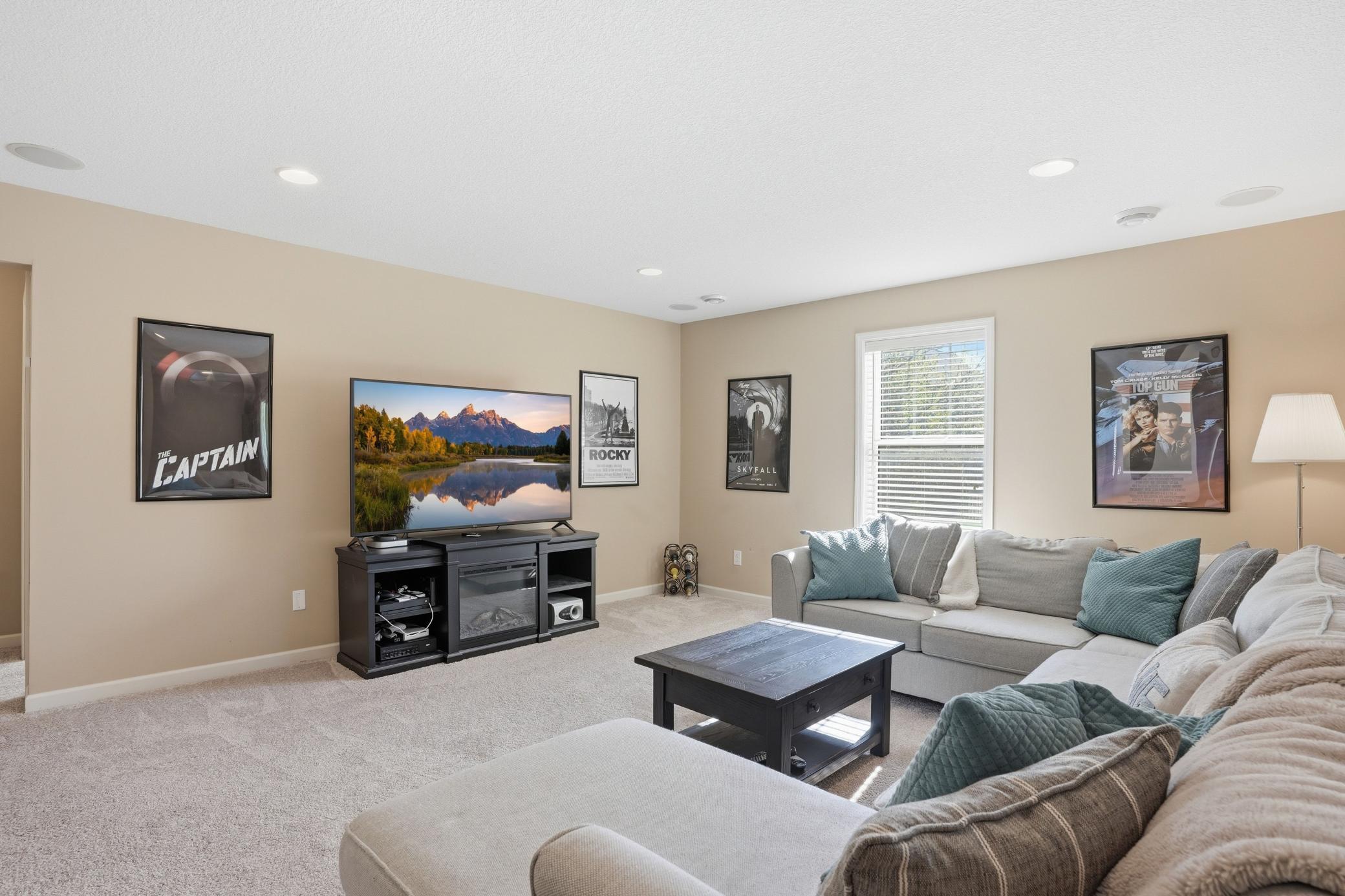 Cozy lower-level family room with plenty of space for oversized seating and movie nights.