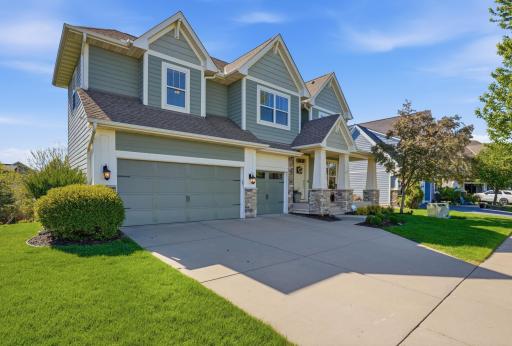 Spacious concrete driveway and attractive exterior details add to the homeâs curb appeal.
