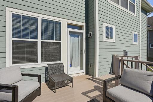 Maintenance-free composite deck with easy access to the backyard and beautiful outdoor living space.