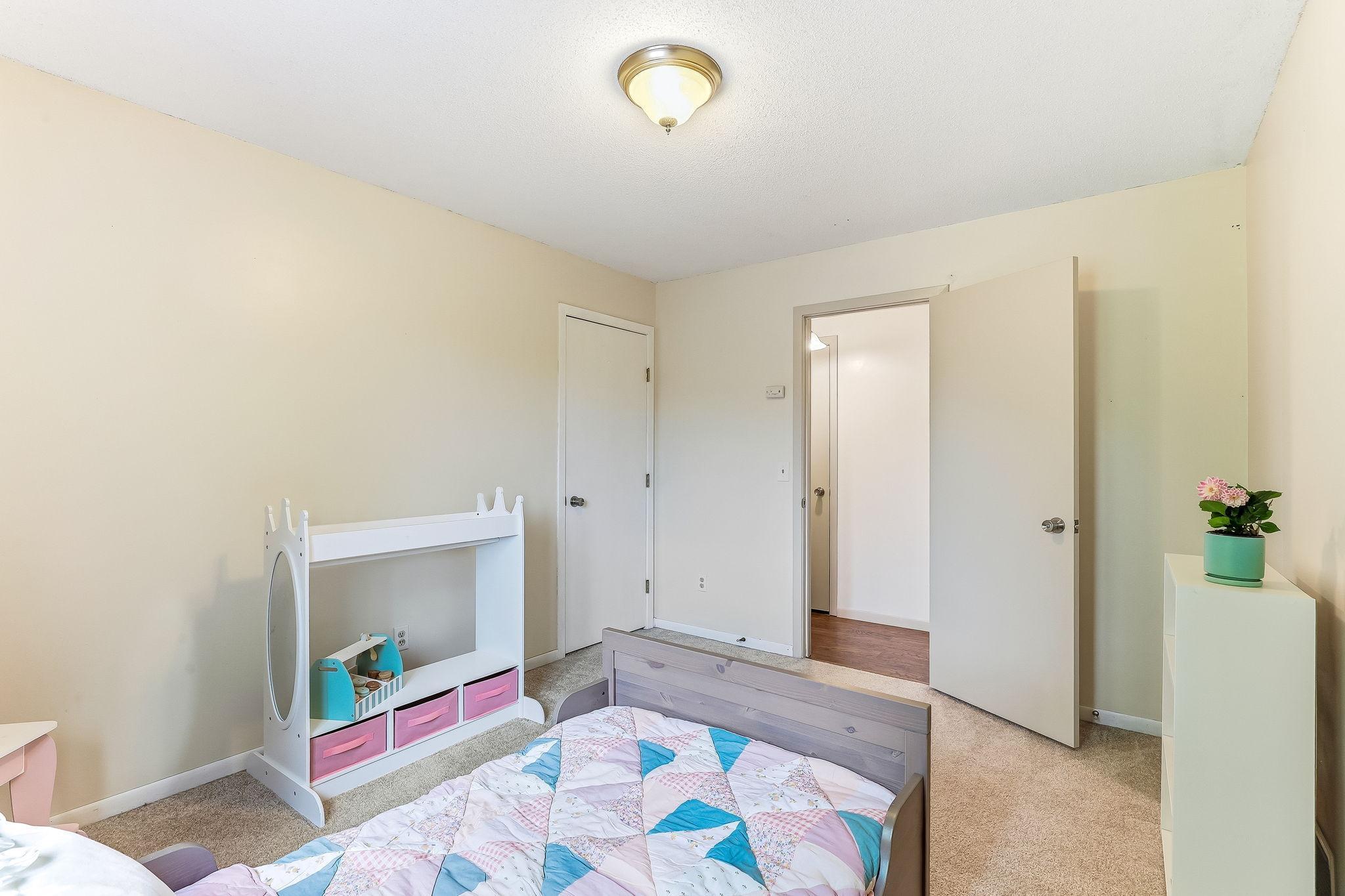 Bright upper-level bedroom at 7653 Borman Way offering neutral tones, generous layout, and comfortable living space in a move-in ready Inver Grove Heights home near St. Paul and Twin Cities amenities.