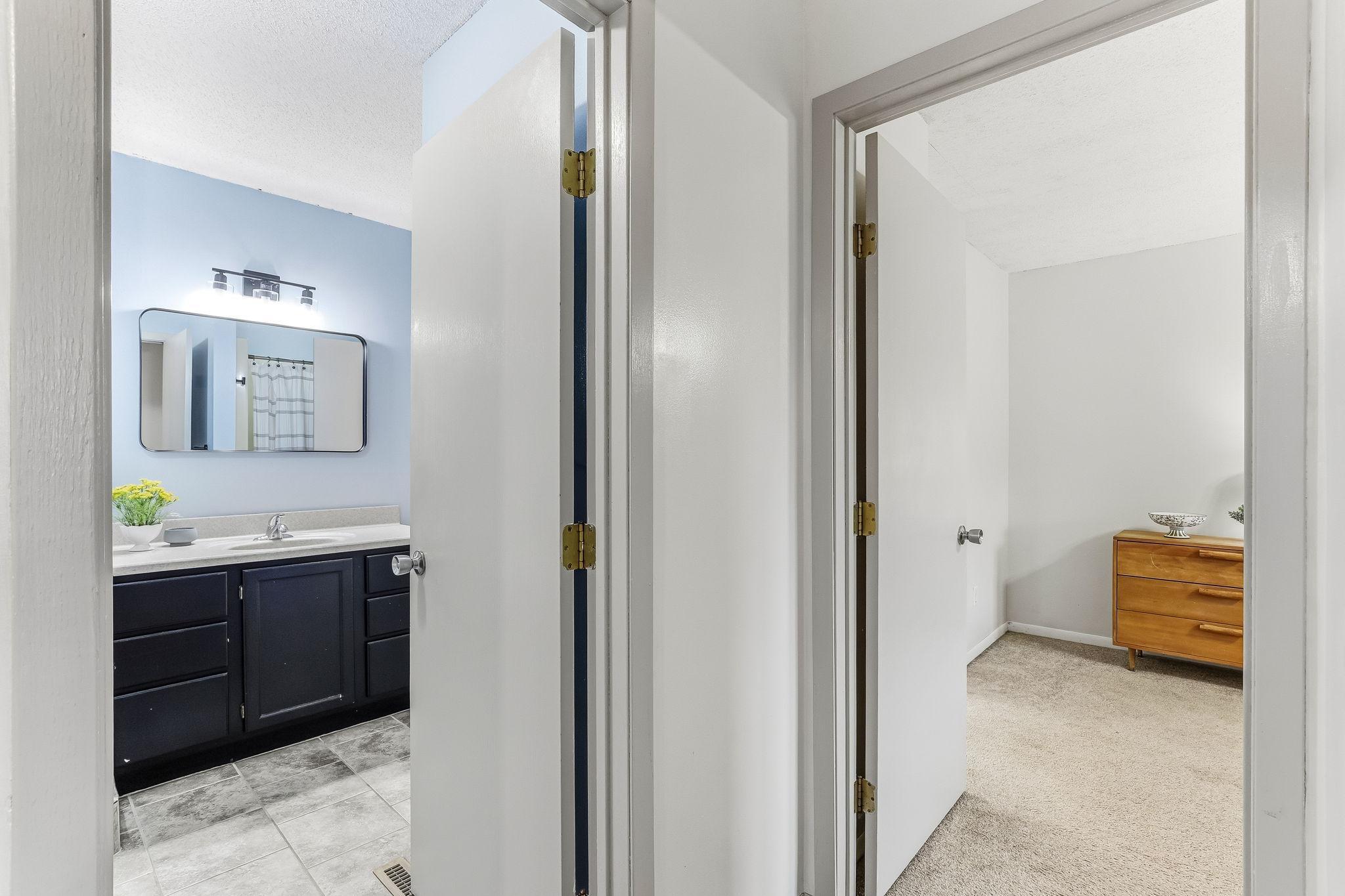 Upper-level hallway leading to bedrooms and bath in this Inver Grove Heights townhome featuring neutral finishes, updated flooring, and a functional layout designed for comfortable everyday living.