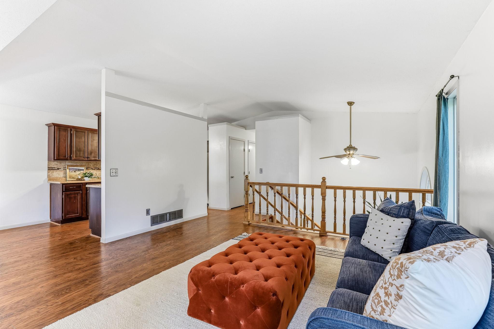 Bright and open main living area at 7653 Borman Way showcasing updated flooring, split-level architecture, open sightlines to the kitchen, and move-in ready living in a convenient Inver Grove Heights location.