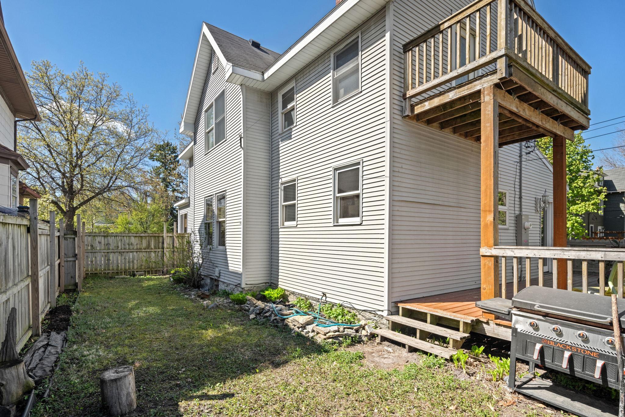 Fenced in yard with 2 decks