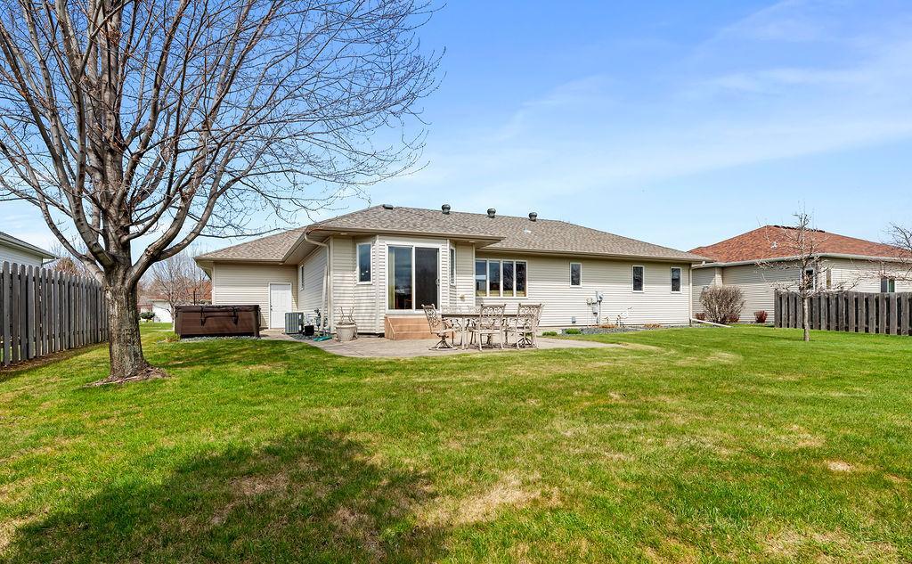 Concrete & paver patio in your huge backyard. Hot tub included!